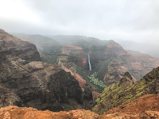Waterfall in the distance on a hike in Kauai Hawaii