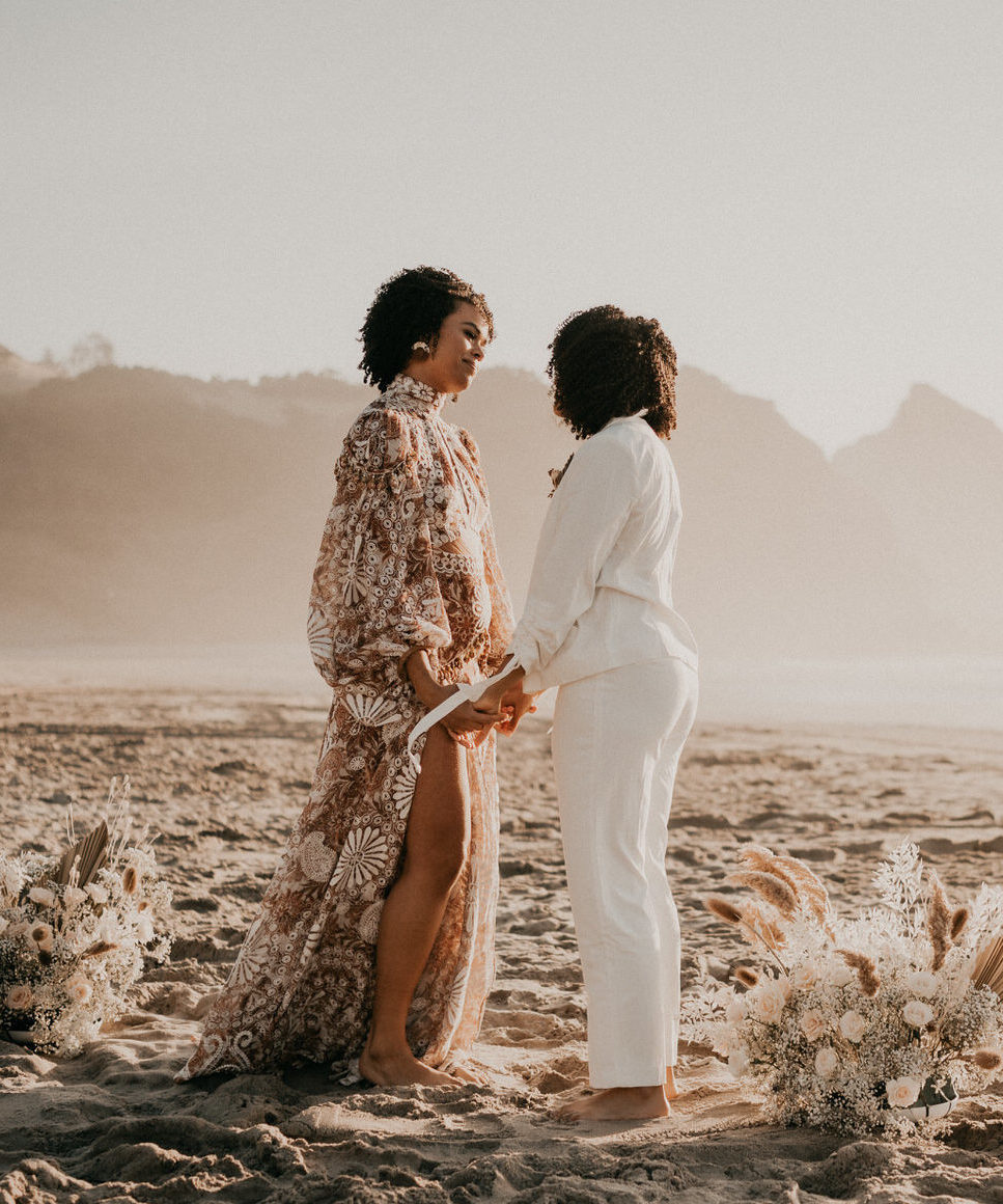 Epic Adventure Elopement - LGBTQ couple saying vows on Oregon Coast beach